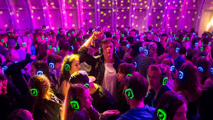 Festival goers dance at the silent disco stage during Open'er music Festival in Gdynia